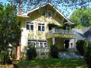Yellow sun dappled house in Ladd's Addition